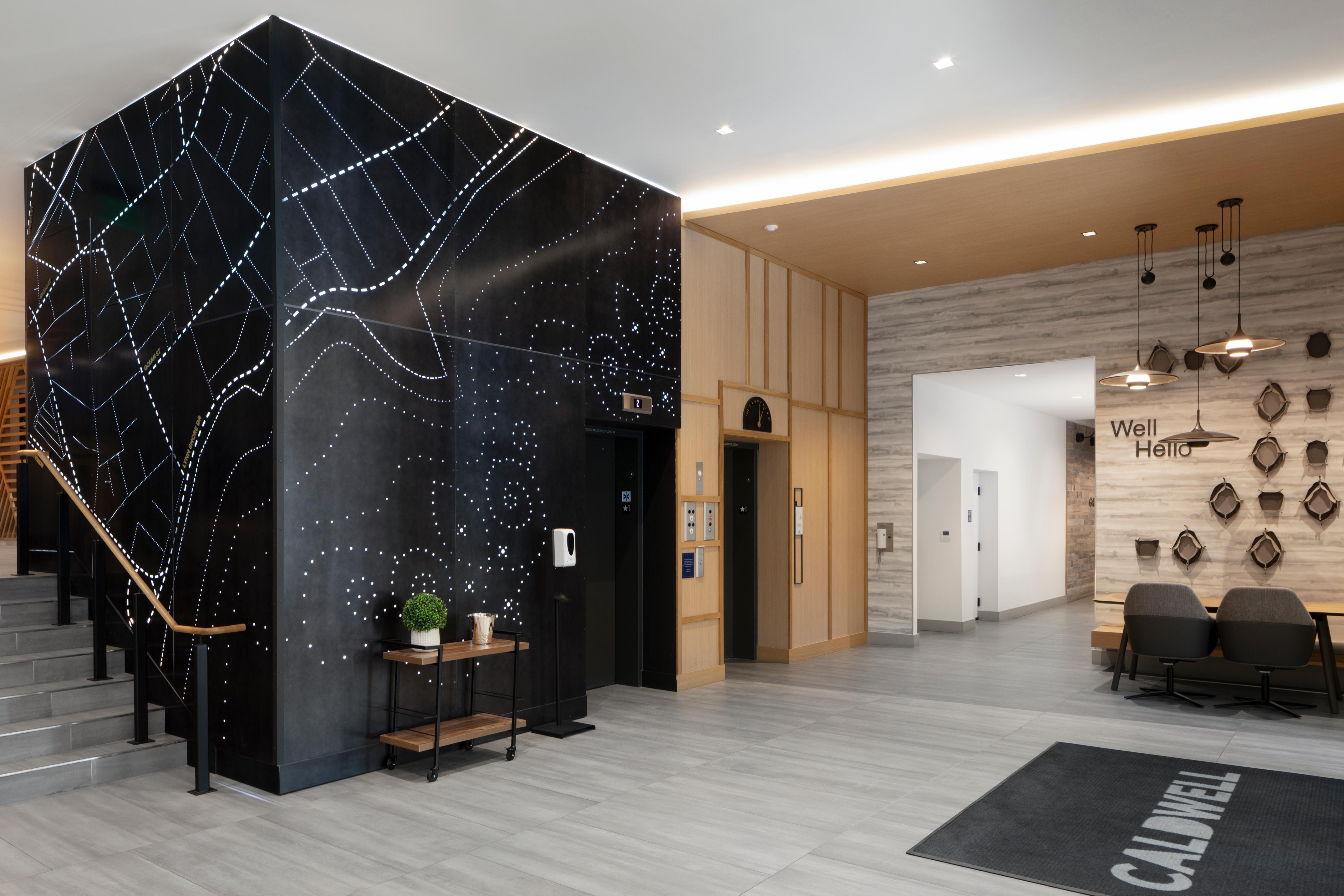 Elevator lobby with map mural on wall